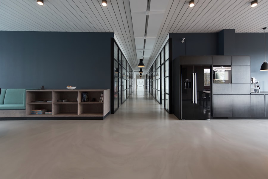 Minimal home office with single clear desk surface and wall-mounted shelving — organized cognitive workspace that eliminates working memory tax