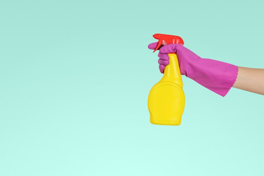 Person quickly wiping a kitchen counter for 2 minutes as part of a daily cleaning habit — the distributed approach that prevents surface grime from requiring deep cleaning sessions