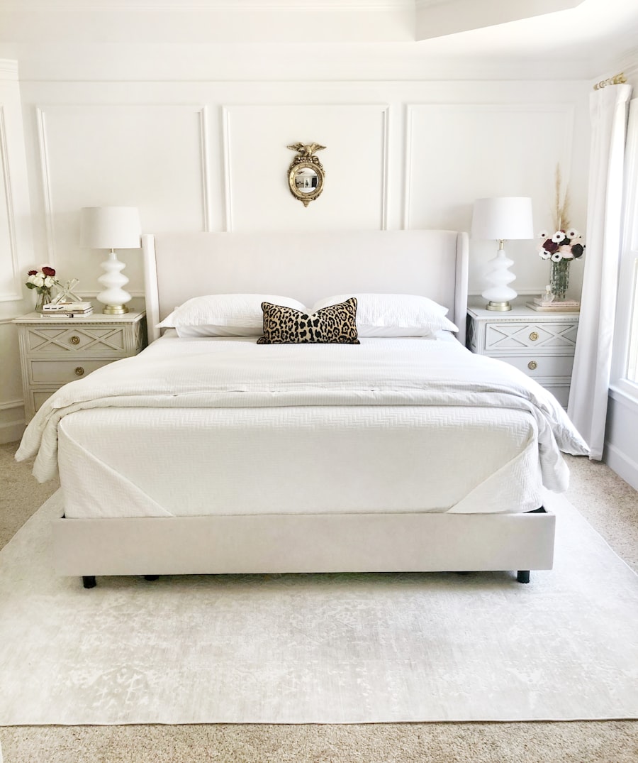 Bed made with three distinct textile layers — white fitted sheet as base, natural linen duvet as middle layer, folded waffle throw at foot — showing the three-layer bed styling formula