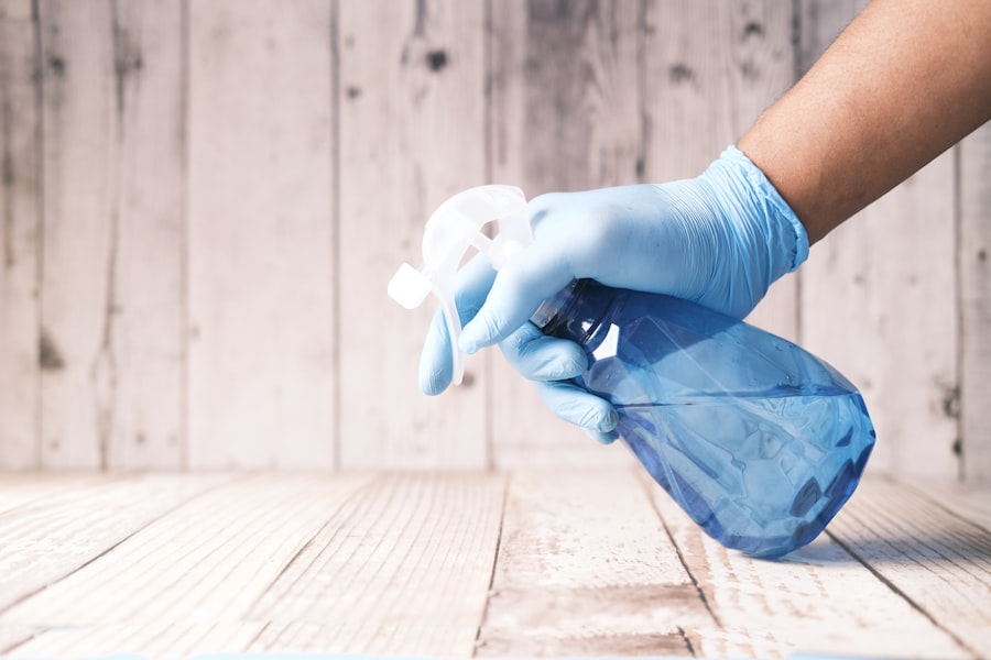 Two people each cleaning a different section of a shared living space — separate zone ownership in practice, each resident working on their assigned monthly zone independently