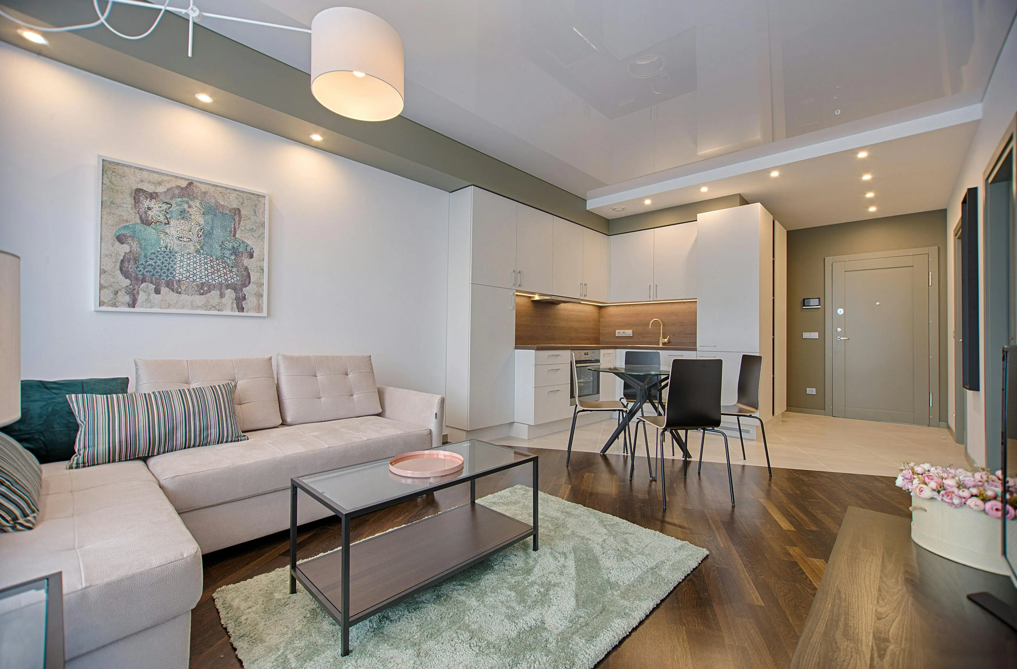 Clean organized living room with natural light and tidy storage